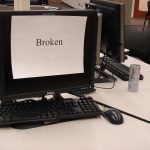 computer screen with "broken" sign on it