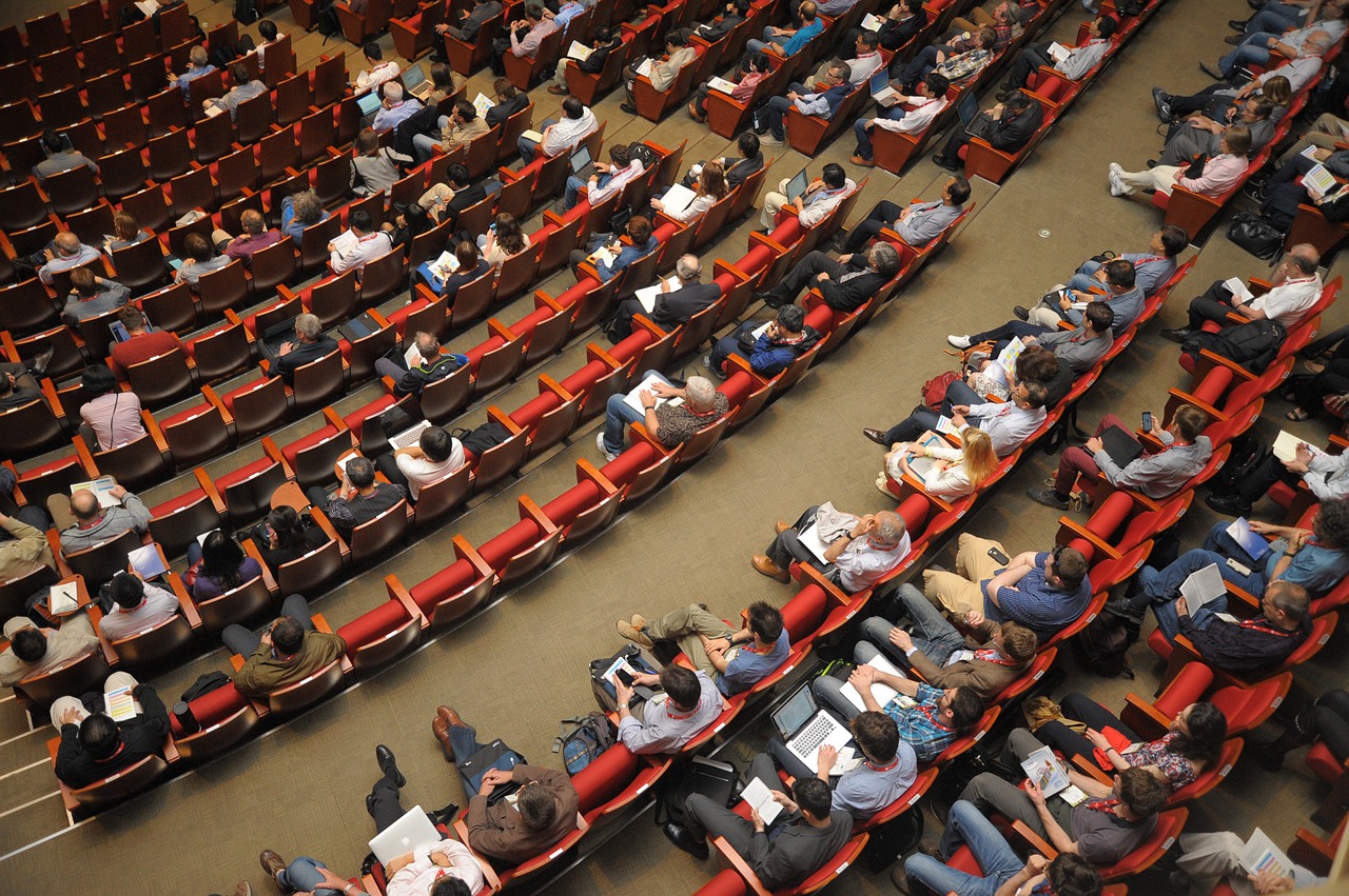 aerial view of many people seated at conference